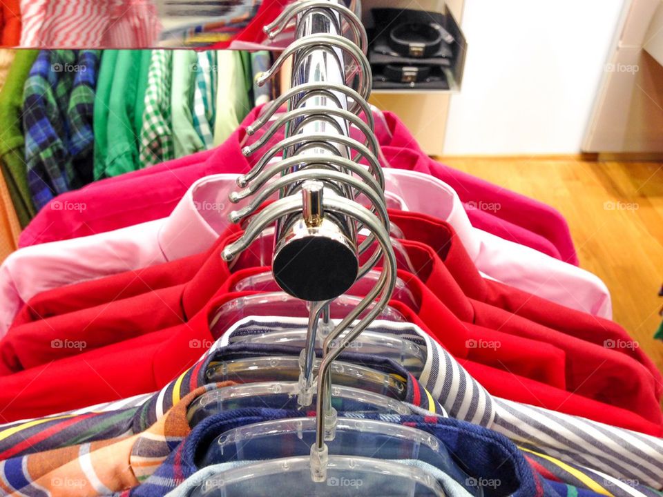 Close-up of shirts on hangers