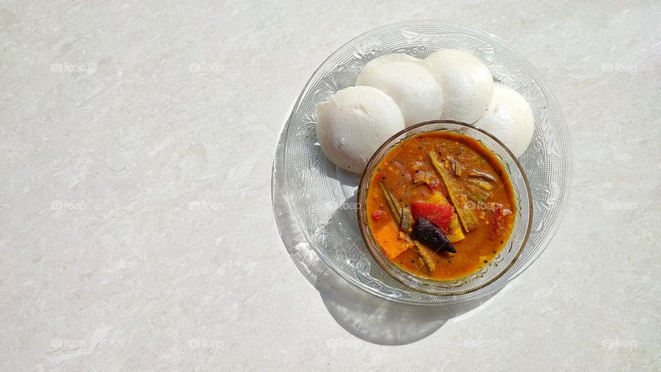 Idli sambar A south Indian breakfast but available throughout India, Idli has a fluffy texture and sambar is a vegetable curry with medium spicy