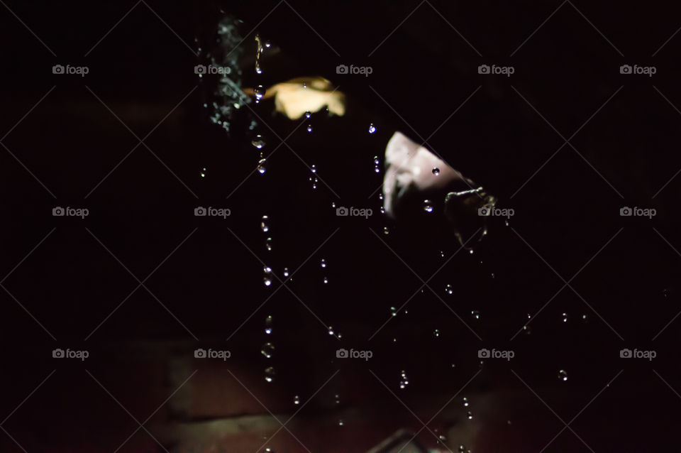 Water falling into home through hole in roof 