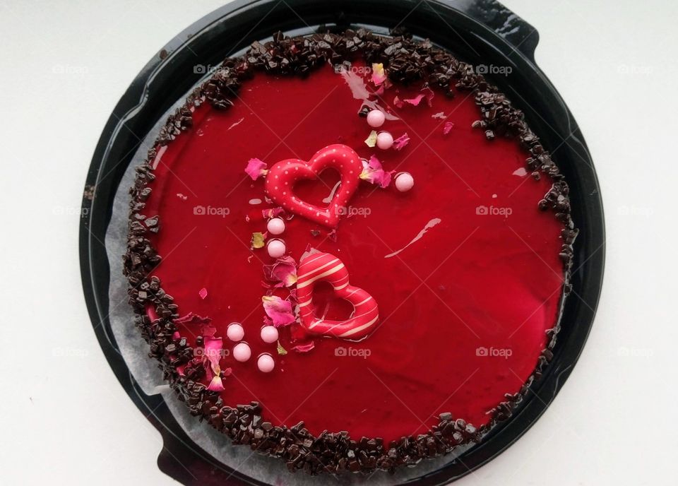 Chocolate cake decorated with red jelly with hearts ❤️🎂❤️