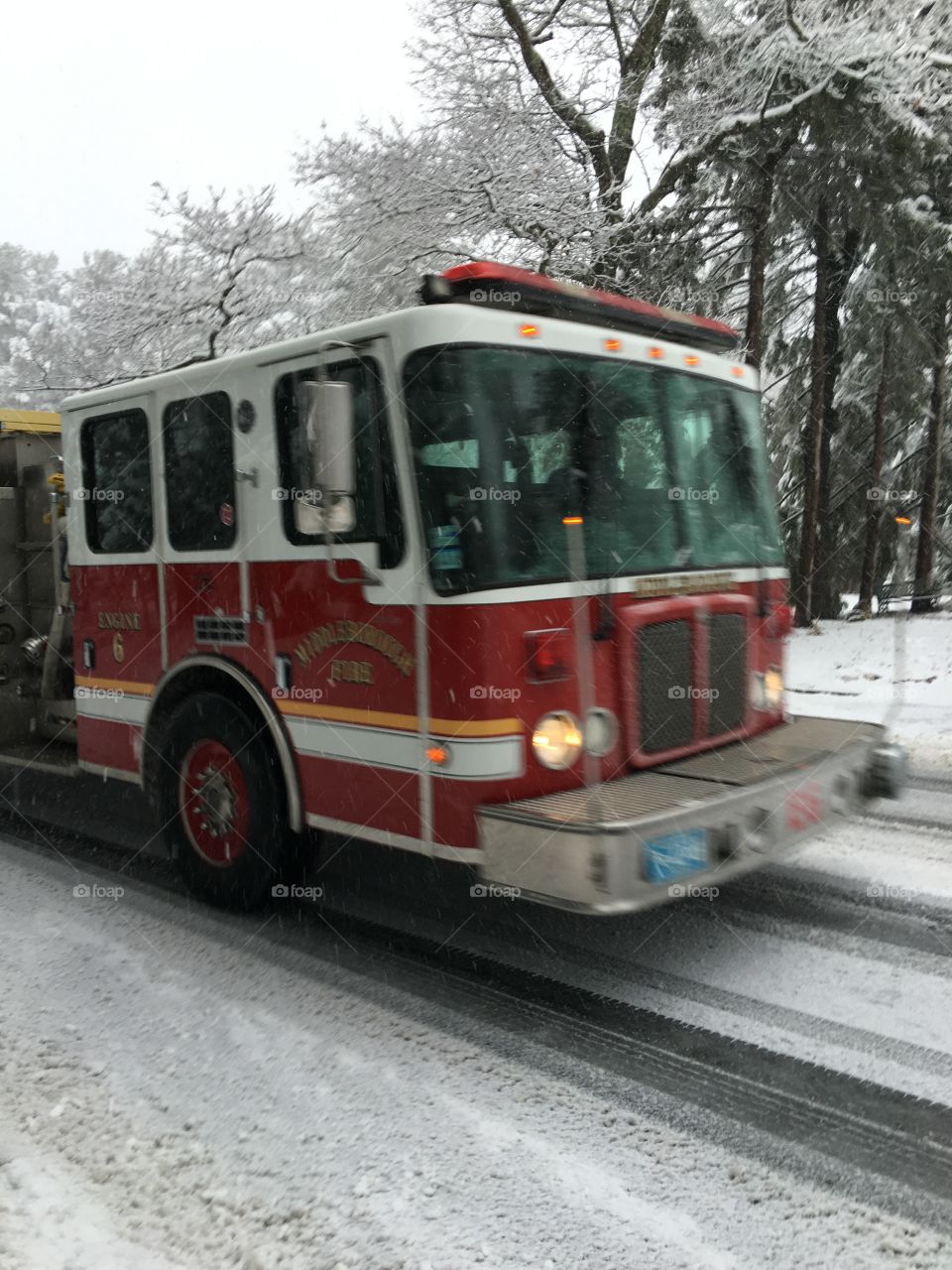 Fire Engine During Snow Storm

Caught a pic of this Engine as it went flying by the house during a snow storm. The horns were blowing so there was some sort of emergency somewhere in our town.