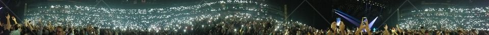 modern day lighters waving at a concert
