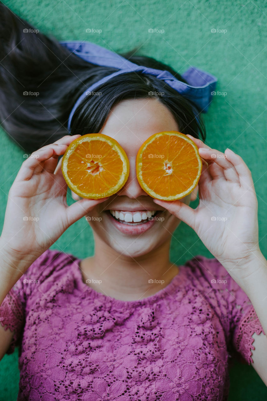 Happy girl with oranges 