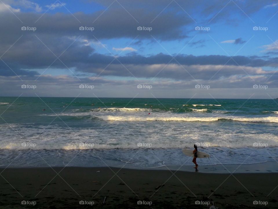 Morning surf just after sunrise in Baler, Aurora, Philippines 