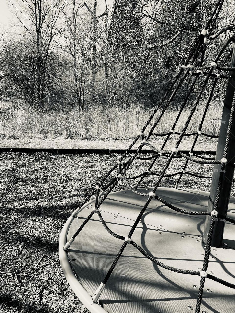 Monochrome playground equipment, at the playground with kids, playing outside with children, playing on the merry go round, outside with mommy, mommy and me on the playground 