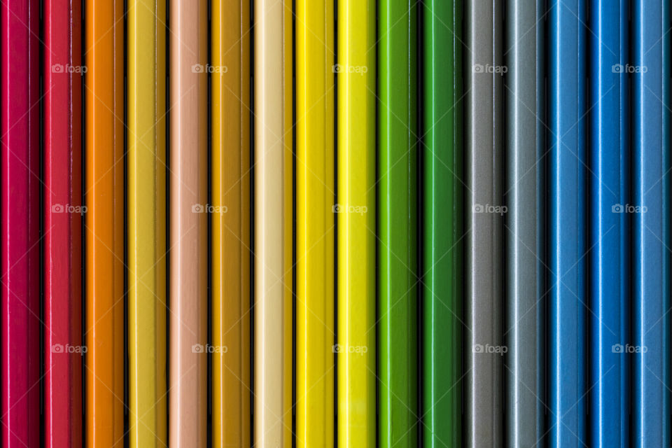 A colorful portrait of all colored penicils in a box of pencil to color with.