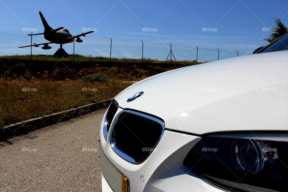 BMW E92 front kidney grill closeup with jet fighter in background