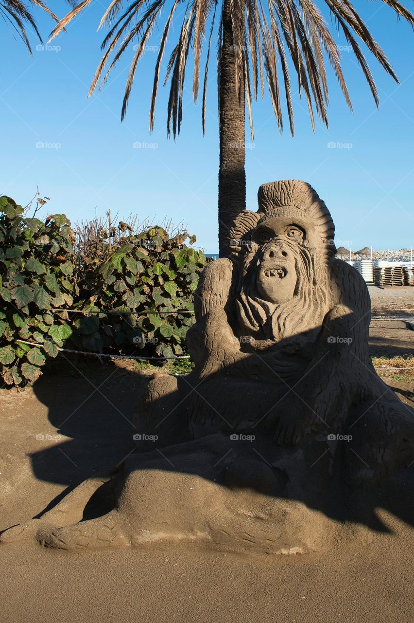 Gorilla sand sculpture on the beach of Banalmadena, Malaga, Spain