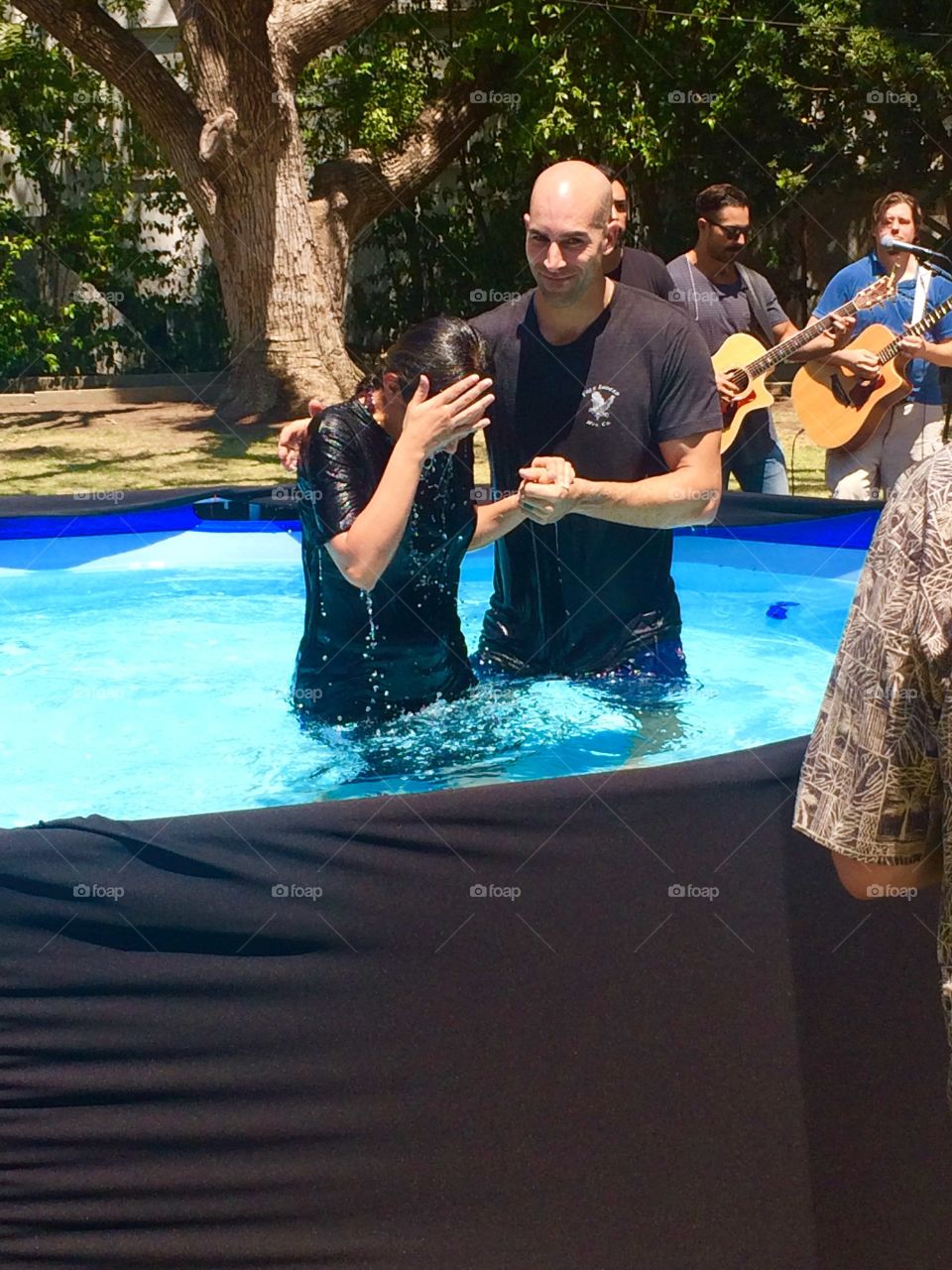 Father and daughter in pool