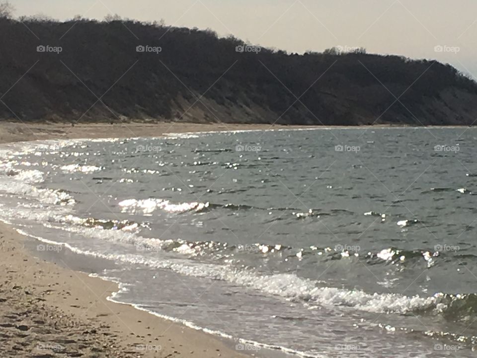 Waves crashing on the beach.