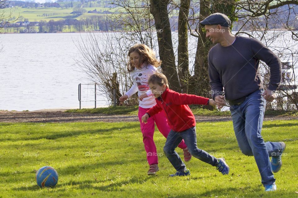 Happy Family Playing Football