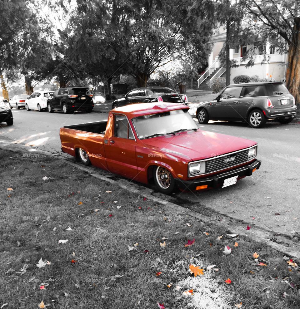 Low rider accented in orange in local neighbourhood 