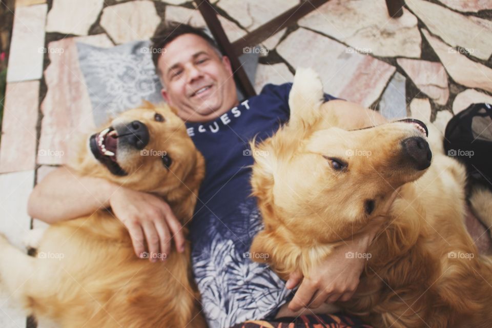 happy man with his dog friends