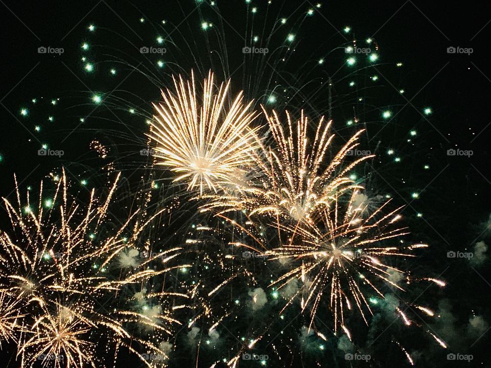 Fireworks display in white and green