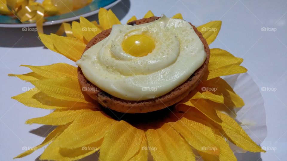 Yellow frosting sunflower cookie