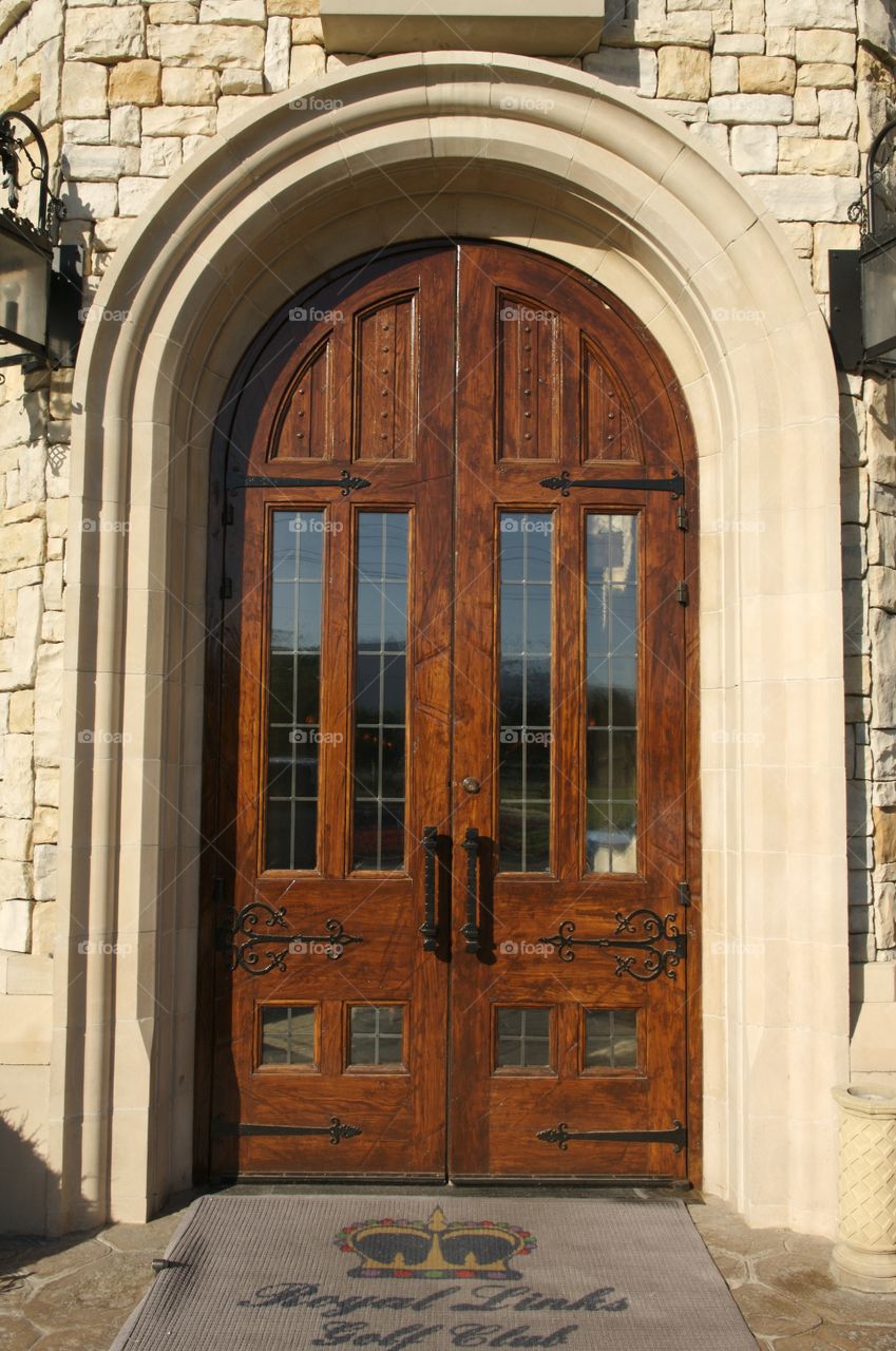 Image of a large wooden door with Windows