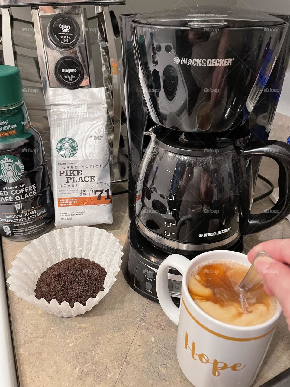 Stirring my French Vanilla, Fat Free International Delight, in my Starbucks coffee, which is showing how I make mine