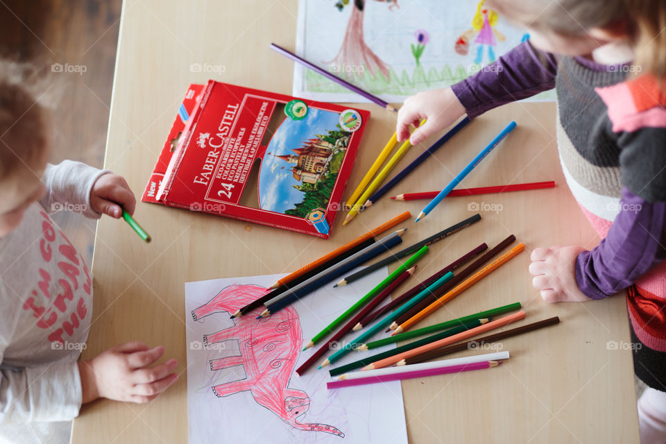 Colours of the world. Children with mom drawing using crayons