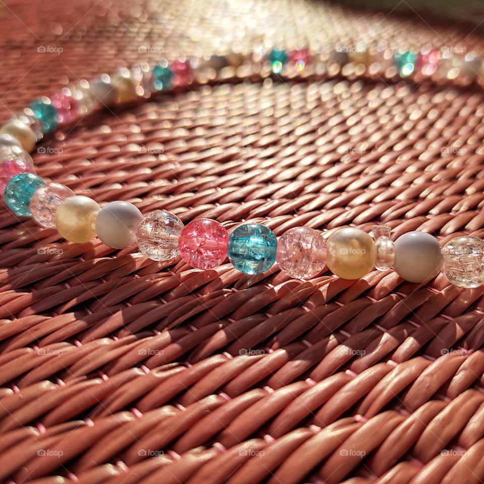 beads on mat making textured shadow.