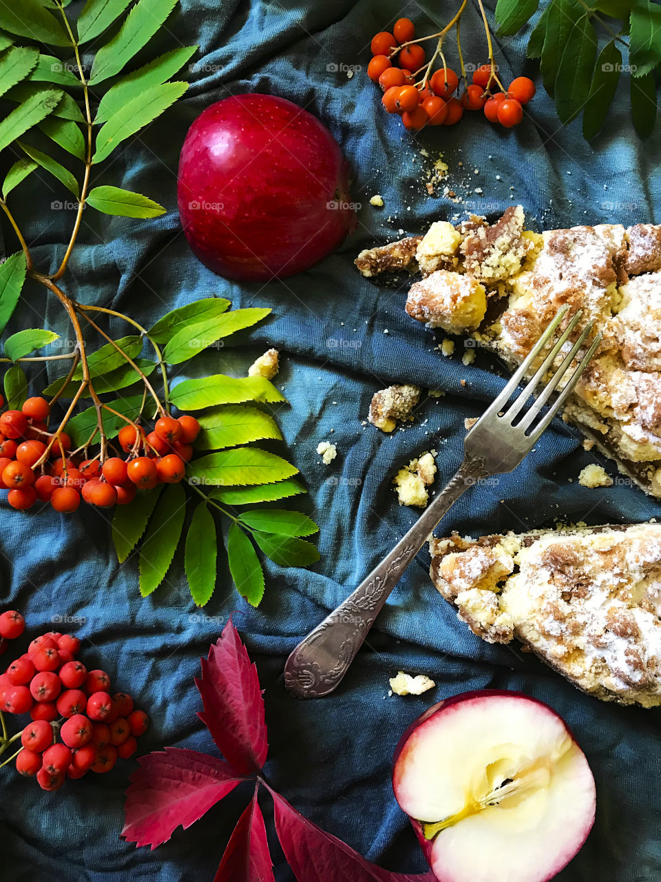 Apple pie decorated by fallen autumn leaves 