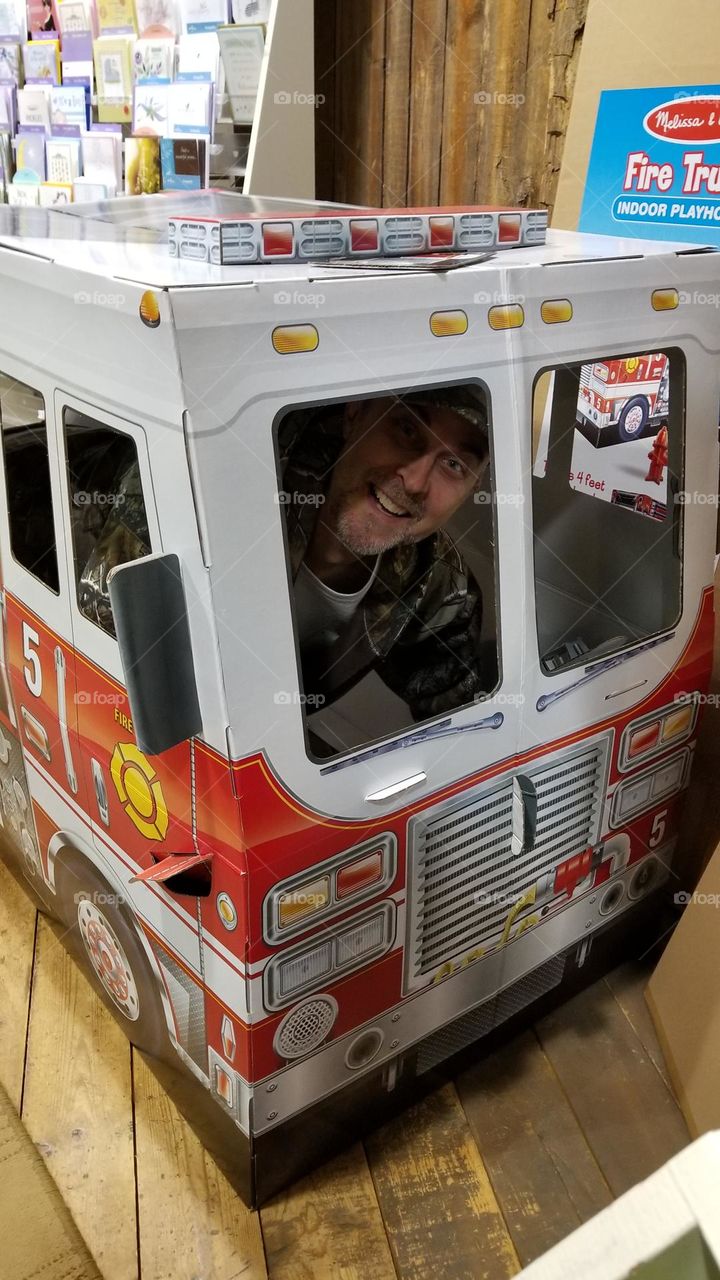 Goofing around in the play firetruck