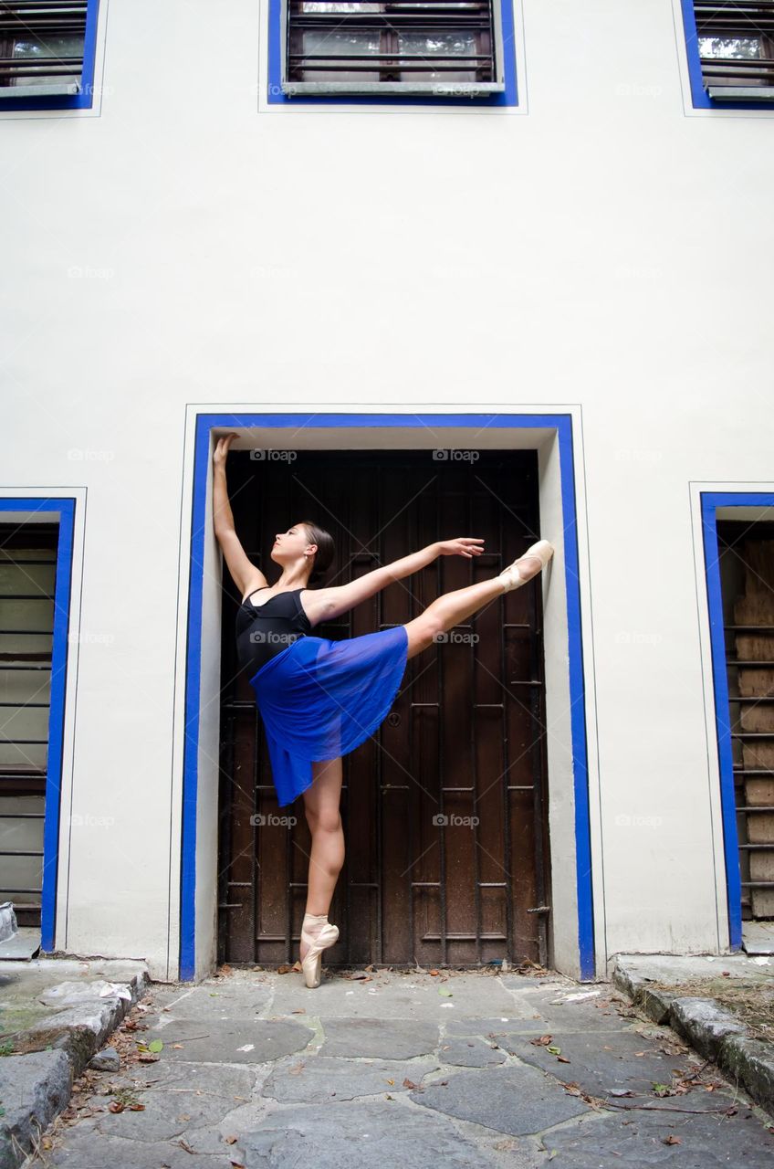 Young Female Ballerina Dancing Outside