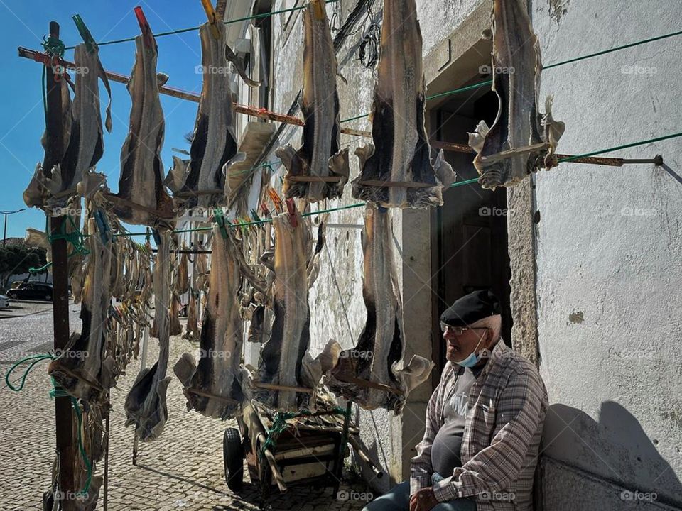 Old men selling his fish in Açores streets.