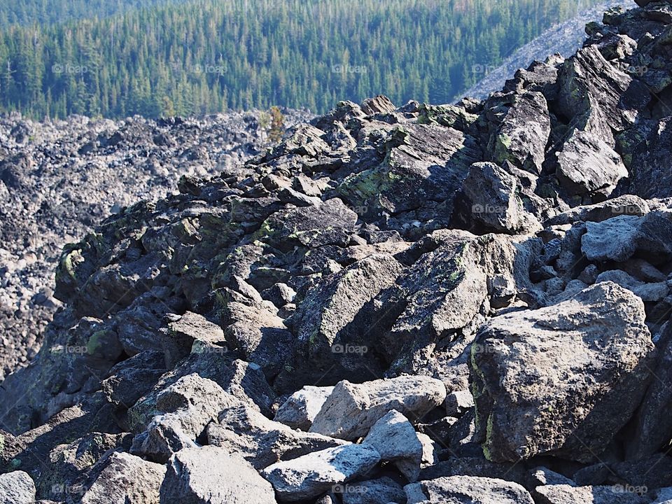 The rugged terrain of the jagged rocks at the Big Obsidian Flow in the Newberry National Volcanic Monument in Central Oregon in the fall. 