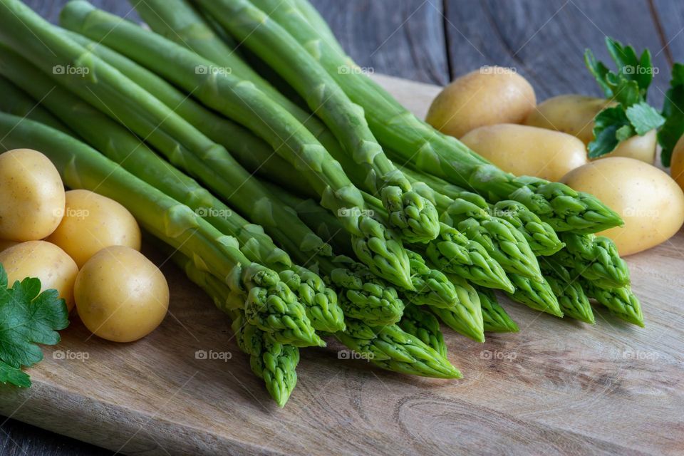 fresh green asparagus and potatoes in spring