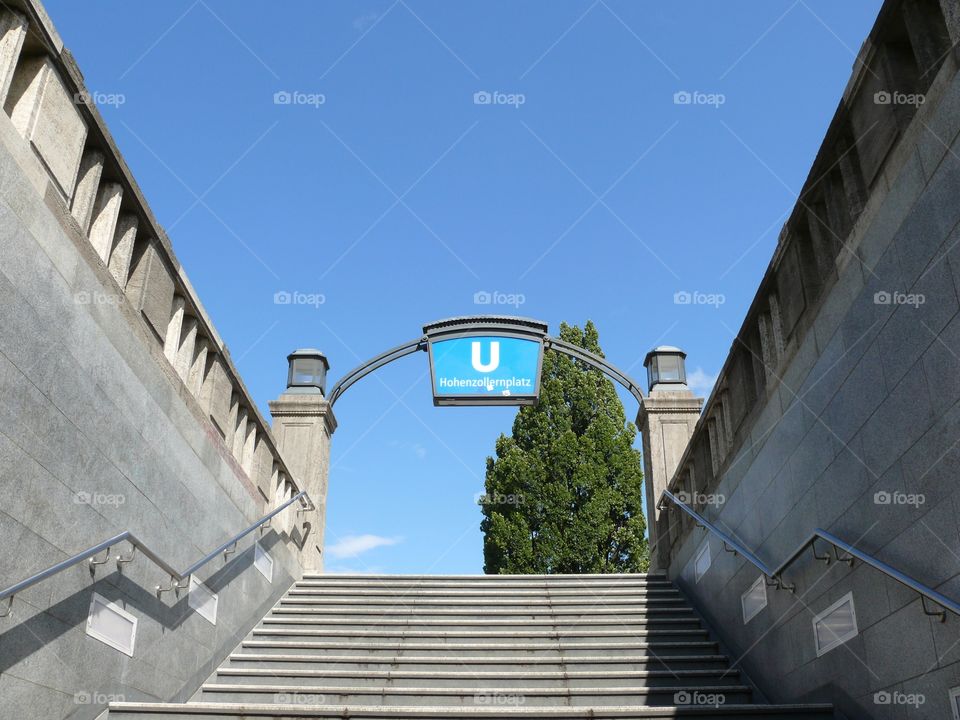 Low angle view of staircase and metro sign in Berlin, Germany.