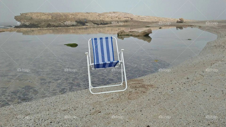 One chair near the beach