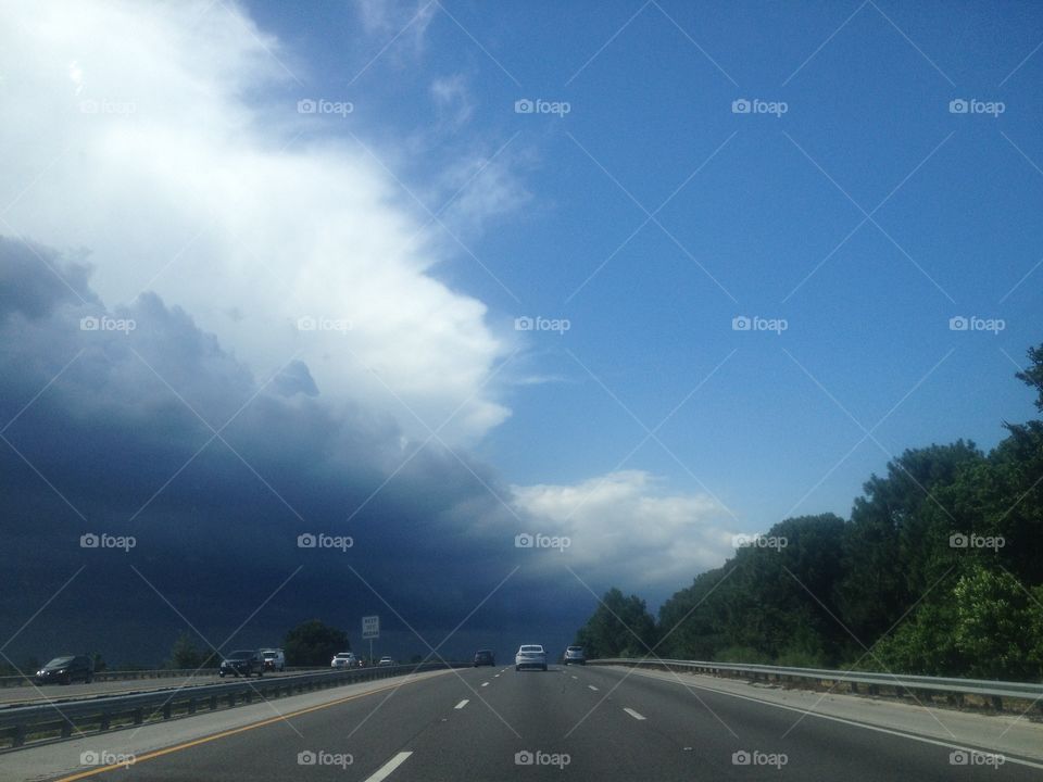 Storm clouds over florida road