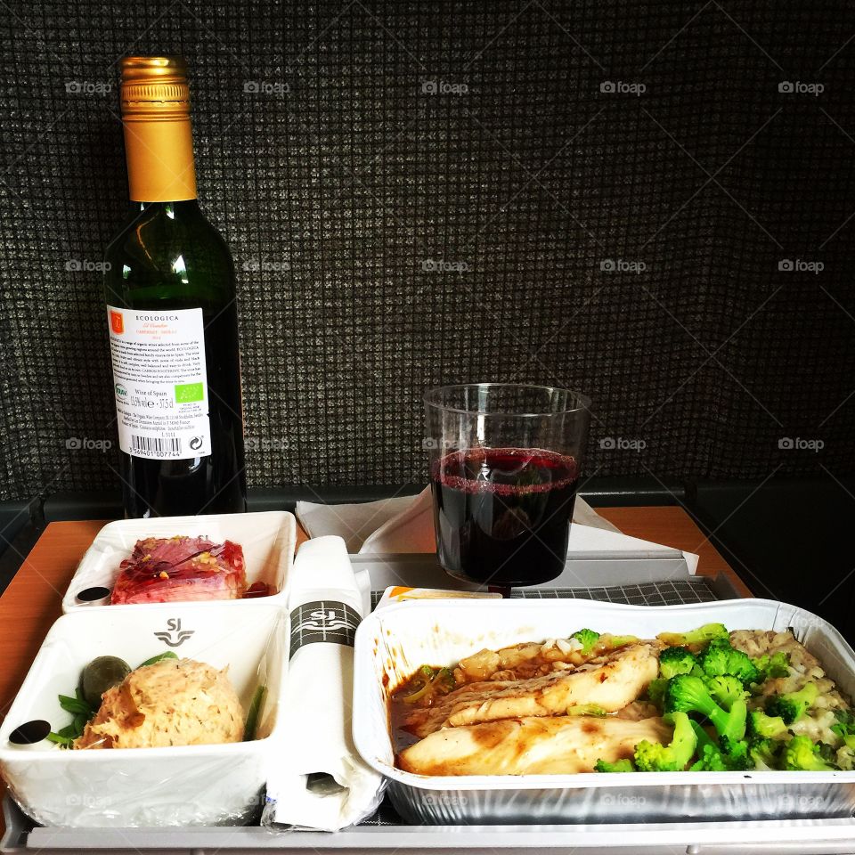 Train trip meal. Three courses meal with red wine on a train trip