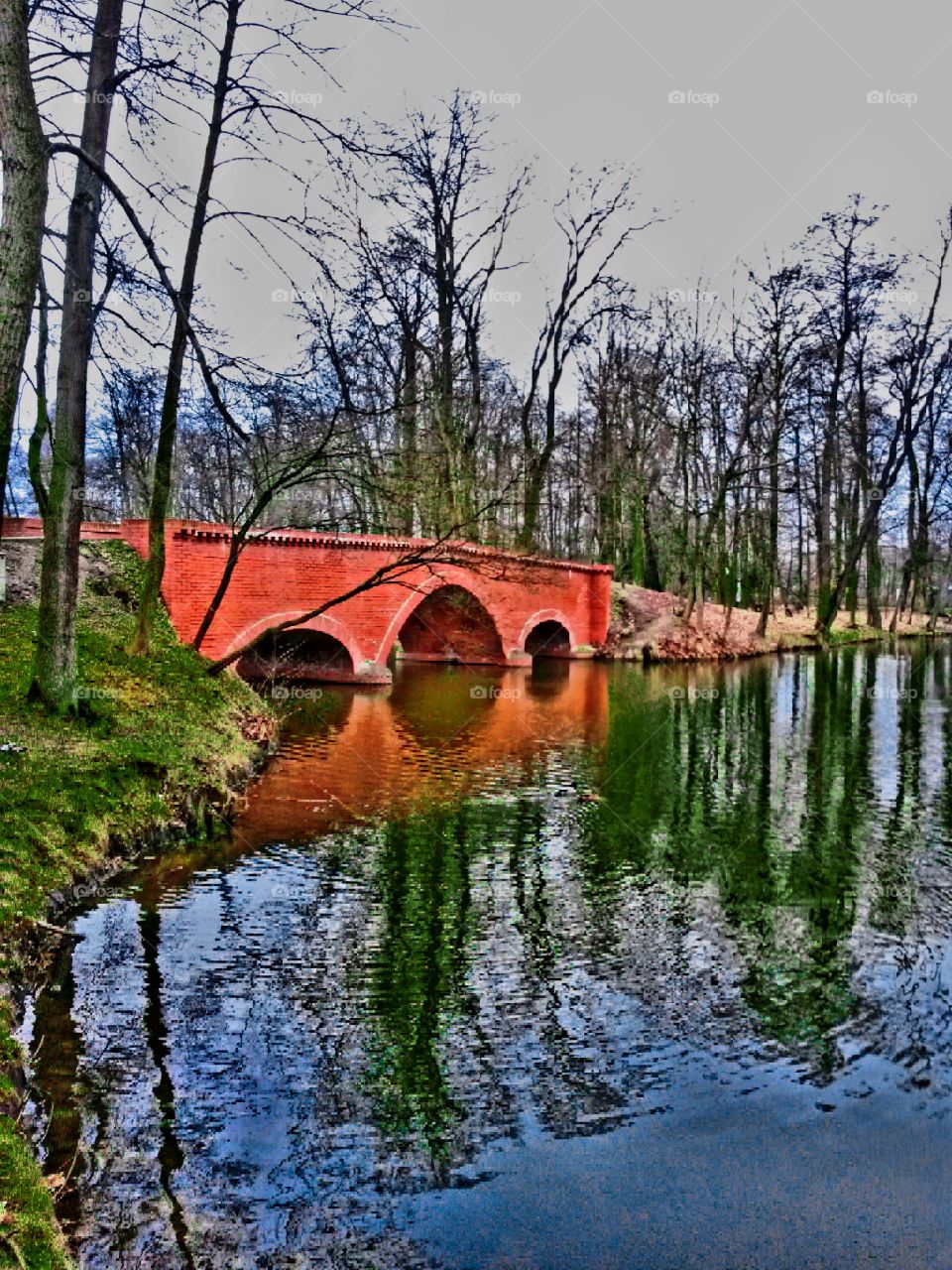bridge over big pond. Castle park in Poland