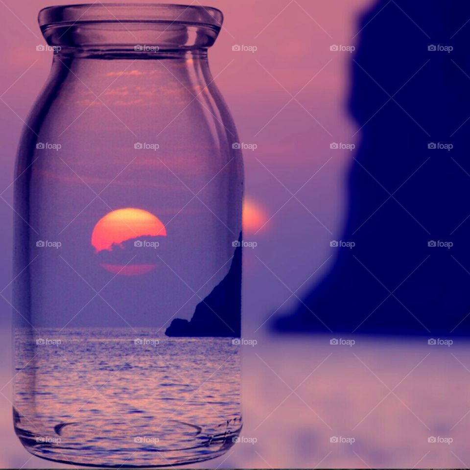 Bottle with a broken sun (Praia - Italy ).