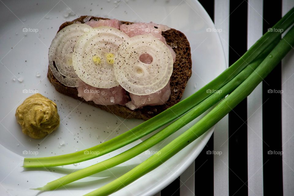 healthy snack . whole-wheat bread, north salted fish, mustard and onion