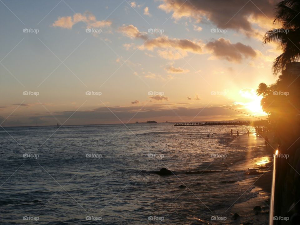 Hawaiian sunset. Honeymoon stroll