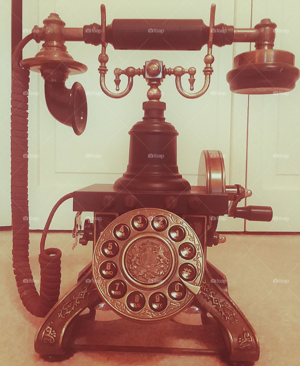 a gorgeous old fashioned telephone with a retro wash