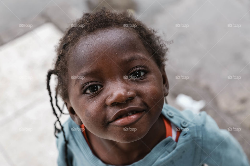 Close-up of African little girl looking at camera