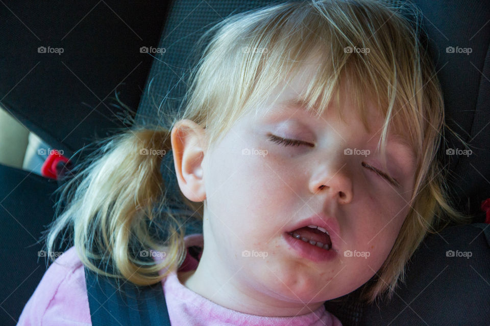 Sleeping child in car.