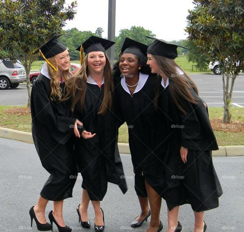 Group of happy female graduate students