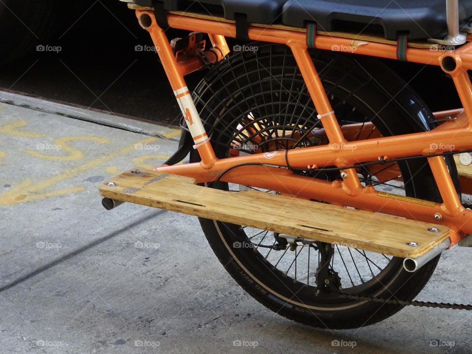 Cool orange back of a bicycle parking 