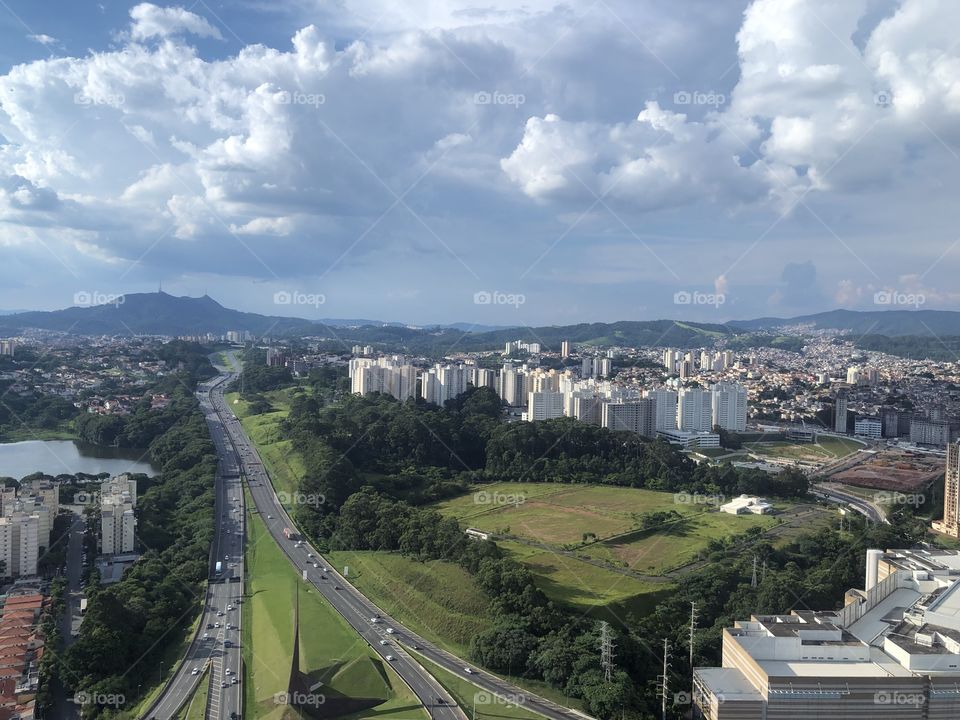 Road viewfinder the top with the city snd the nature