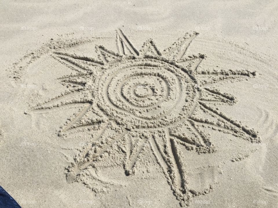 Sun and sand . Sand drawing in Cape May, New Jersey 