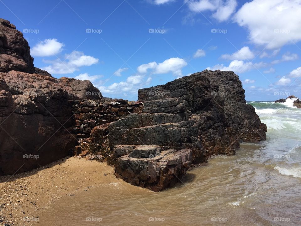 Uruguay coast - a rocks castle in the surf 