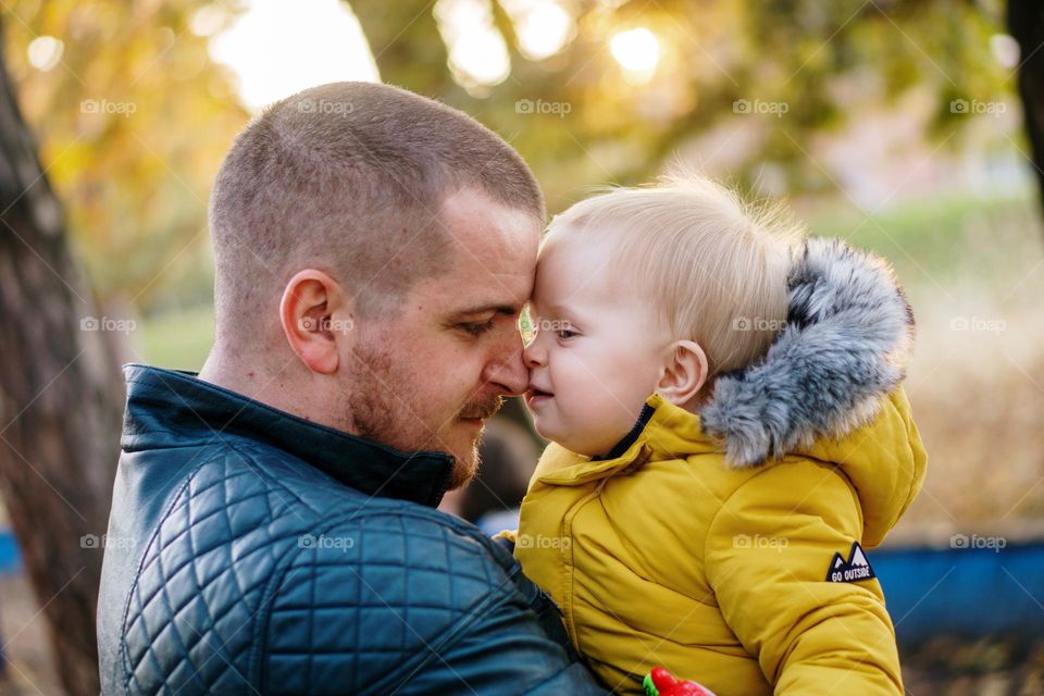 Father and daughter in a park