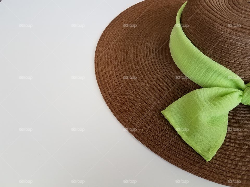 Close-up of hat with green scarf