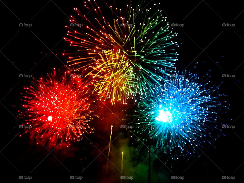 Fireworks exploding in vivid colors.