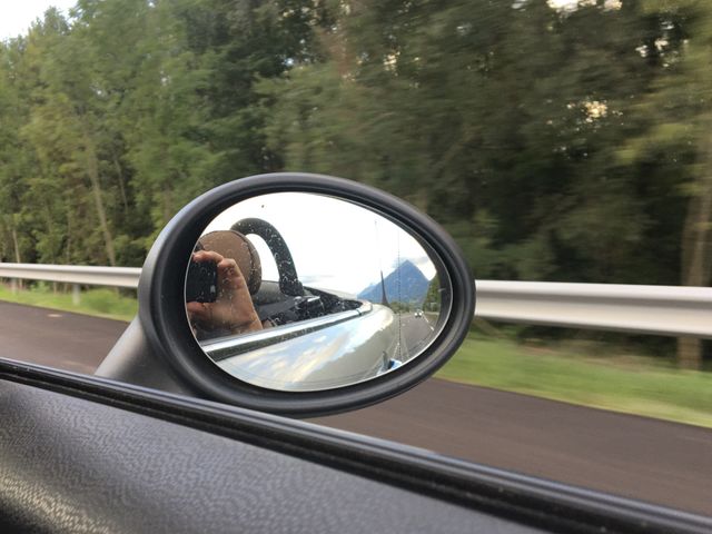 On the road with mountain in mirror