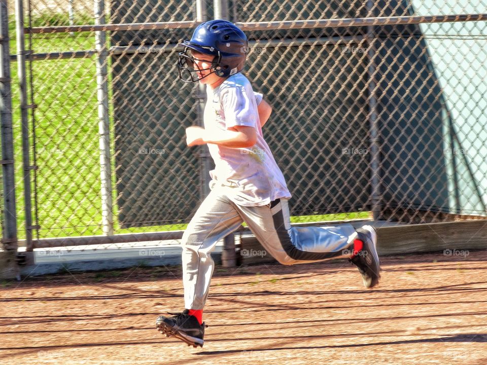 Love Running. Young Baseball Runner
